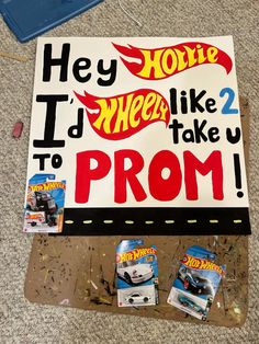 there is a sign that says hey holie wheels like 2 to prom with hot wheels on it