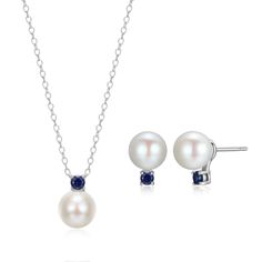 Elevate your look with this timeless jewelry set crafted in rhodium-plated sterling silver. Boasting round genuine cultured freshwater pearls and brilliant created blue sapphire gemstones, the necklace suspends from an 18" cable chain with lobster clasp, and is paired with matching stud earrings. Formal Jewelry Sets With Round Pearl Pendant, Formal Round Pearl Pendant Jewelry Sets, Formal Round Jewelry Sets With Pearl Pendant, Formal Jewelry Sets With Pearl Pendant, Blue Round Jewelry With Pearl Charm, Blue Round Pearl Charm Jewelry, Elegant Sapphire Jewelry Sets In Sterling Silver, Elegant Sapphire Sterling Silver Jewelry Sets, Sterling Silver Blue Jewelry With Pearl Drop