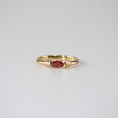 Elegant Stackable Garnet Gemstone Rings, Elegant Garnet Gemstone Stackable Rings, Elegant Red Crystal Round Ring, Ruby Birthstone Ring With Round Band, Elegant Red Round Crystal Ring, Garnet Ruby Ring Gift, Classic Red Birthstone Ring With Ethical Gemstones, Ruby Birthstone Ring With Gemstone Accents For Promise, Oval Red Gemstone Birthstone Ring