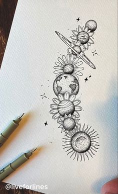 a drawing of the sun and planets on paper