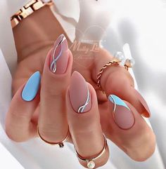 a woman's hand with some manies and rings on her fingers, in front of a white background