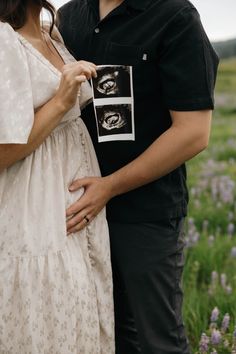 a pregnant couple standing next to each other