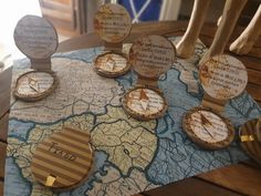 several wooden clocks sitting on top of a map