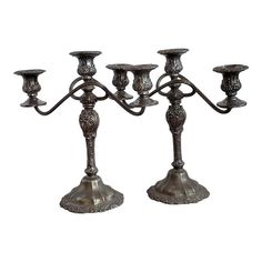 an ornate metal candelabra with five candles