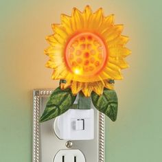 a light switch with a sunflower on it