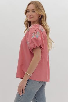 Introducing the Shelby puff sleeve top, perfect for all your Fall Southern outings. This solid V-neck top features delicate bubble sleeves with lovely patch embroidery. Complete with a self-tie at the neck and elastic cuffs, this top offer both comfort and style. Fits true to size Model is 5'10" with a 26" waist, 36" hips and a 36" Bust and wearing a small. Spring Short Sleeve Peasant Top With Gathered Sleeves, Spring V-neck Peasant Top With Gathered Sleeves, Spring Puff Sleeve Blouse With Smocked Cuffs, Cotton V-neck Puff Sleeve Top For Brunch, Feminine Bishop Sleeve Tops For Spring, Puff Sleeve Top For Brunch, Cotton Balloon Sleeve Top For Brunch, Spring Pink Tops With Elastic Sleeves, Pink Tops With Elastic Sleeves For Spring