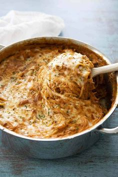 an easy one pot cheesy spaghetti pie is ready to be eaten in the oven