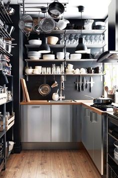 a kitchen filled with lots of pots and pans