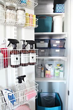 an organized pantry with bottles, containers and cleaning products on shelves next to baskets in bins