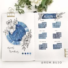 an open notebook with flowers and calendars on it