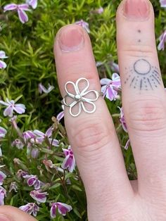 Elevate your style with a sterling silver 'Flower Power Ring' 🌸 - a handcrafted beauty that effortlessly blends simplicity and elegance.  This dainty piece adds a touch of nature-inspired charm to your look, making it a must-have for any jewelry collection. Embrace the grace of petals and embrace timeless sophistication. Handmade to order - please be patient while I make your piece 🔨 🌸 Dainty Toe Ring Jewelry With Simple Design, Delicate Flower Shaped Ring For Spring, Delicate Handmade Rings For Everyday, Dainty Hypoallergenic Toe Ring Jewelry, Delicate Tiny Toe Ring Jewelry, Delicate Toe Ring Jewelry, Delicate Hypoallergenic Open Ring Jewelry, Delicate Hypoallergenic Toe Ring Jewelry, Handmade Stackable Rings For Everyday Wear