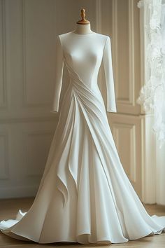 a white wedding dress on a mannequin