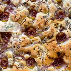 a pizza with olives, onions and cheese on it's crust is shown