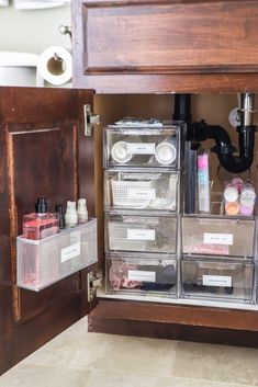 the drawers are organized with clear plastic bins for makeup and personal care items,