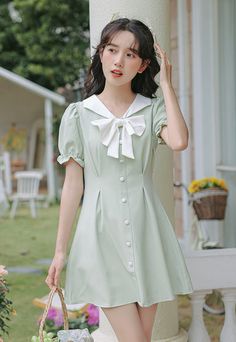 Mini dress with a sailor collar, sweet bow, faux button front, cinched waist and short puff sleeves. Concealed back zipper. S: 13" across shoulders, 32" chest, 25" waist, 31" lengthM: 13.5" across shoulders, 33.5" chest, 26.5" waist, 31" lengthL: 14" across shoulders, 35" chest, 28" waist, 31" lengthXL: 14.5" across shoulders, 36.5" chest, 29.5" waist, 31" length Sailor Collar Dress, Sailor Collar, Shoe Gifts, Overall Dress, Sweater Blouse, Cinched Waist, Cardigan Jacket, Collar Dress, Puff Sleeves