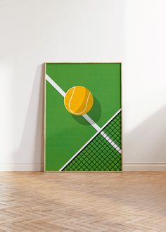 a tennis racket and ball on a green court poster in an empty room with hard wood flooring