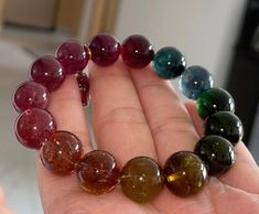 Material:  tourmaline beads  size :  Approx 12mm quantity: one strands 6mm approx 29 pcs one strands 7mm approx25 pcs one strands 8mm approx 22 pcs one strands 9mm approx 21pcs one strands 10mm approx 19 pcs one strands 11mm approx 18pcs one strands 12mm approx 16 pcs one strands 13mm approx 16 pcs one strands 14mm approx 15 pcs one strands 15mm approx 14pcs one strands 16mm approx 14 pcs one strands 17mm approx 13pcs one strands 18mm approx 13pcs one strands 19mm approx 12pcs one strands 20mm a Tourmaline Beaded Bracelets With Natural Stones, Tourmaline Bracelets With Round Beads As A Gift, Tourmaline Gemstone Beaded Bracelets With Round Beads, Spiritual Tourmaline Beaded Bracelets With Round Beads, Spiritual Tourmaline Beaded Bracelet With Round Beads, Tourmaline Gemstone Beads Bracelet, Pretty Accessories, Tourmaline Bracelet, Tourmaline Beads