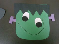 a paper cut out of a green monster