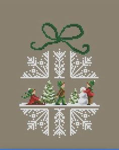 a cross stitch christmas ornament with snowmen and trees