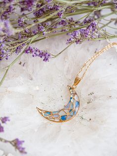 Experience celestial beauty with our Stainless Steel Crescent Moon Pendant, a uniquely handcrafted jewelry piece perfect for moon lovers and mystics alike. Each moon cradle is carefully filled with different shades of iridescent blue resin, creating a stained glass effect that is both enchanting and eye-catching. Crafted from high-quality, durable stainless steel, this crescent moon pendant boasts lasting shine and resilience. Its design is a testament to intricate craftsmanship, capturing the m Mystical Clavicle Chain Jewelry For Gift, Mystical Clavicle Chain Jewelry As Gift, Celestial Clavicle Chain For Jewelry Making, Celestial Pendant Necklace Gift For Her, Celestial Pendant Necklace As A Gift For Her, Celestial Pendant Jewelry With Clavicle Chain, Celestial Clavicle Chain Pendant Jewelry, Celestial Round Crystal Necklace For Gift, Celestial Necklaces With Sun And Moon Design For Gift