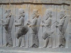 an ancient bask depicting men playing instruments