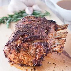 a piece of meat sitting on top of a wooden cutting board