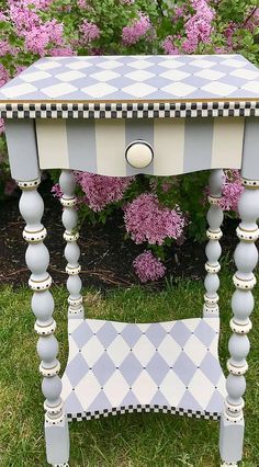 an old table painted in blue and white checkerboard