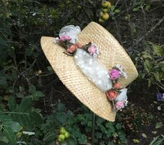 James Egleton Straw Hat.  Size 57cm-57.5cm  Polkadot tulle band with floral sprays in pinks, orange and cream hues.  Packed with vintage charm. Natural imperfections in the straw with small breaks consistent  with age and use. In lovely clean condition overall.  Please check your head measurement before you buy! If you need advice on how best to measure your head, please get in touch. Shipping:  I combine postage. I post U.K. 1st class signed for / international tracked and signed.  I will refun Brimmed Top Hat For Summer Garden Party, Adjustable Brimmed Top Hat For Garden Party, Cream Top Hat For Summer Garden Party, Handmade Vintage Hat Bands For Spring, Cream Top Hat For Spring Garden Party, Summer Top Hat For Garden Party With Short Brim, Bohemian Mini Hats For Garden Party In Spring, Handmade Spring Cloche Hat, Handmade Mini Hats For Garden Party