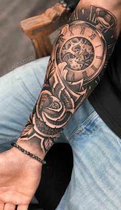 a man with a clock tattoo on his arm