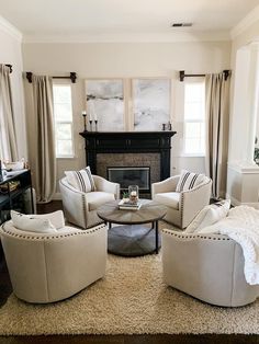 a living room filled with furniture and a fire place