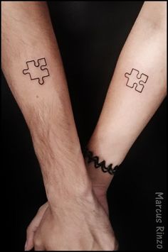 two people with matching tattoos on their arms