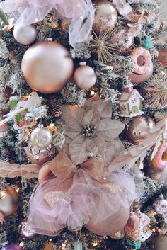 a decorated christmas tree with pink and gold ornaments