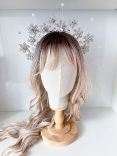 Embrace the magic of winter with this enchanting snowflake crown. Adorned with shimmering snowflakes, sparkling stars, and delicate crystals, this piece is perfect for adding a touch of festive flair to any outfit. Whether you're attending a winter wonderland party, a holiday celebration, or simply want to channel your inner snow queen, this crown is sure to make a statement. SIZE: It is suitable both for a child and an adult. MATERIAL: high-quality artificial snowflakes, and high-quality accessories. 100% handmade I accept individual orders The order is packed in a cardboard box and beautifully decorated inside. ? Ask what interests you and we will be happy to answer your questions. DELIVERY: I will notify you when the package is on the way. I will also send a tracking number for your ord Winter Ball Crown, Ice Icicles Crystal Crown, Snowflake Headbands, Braut Winter, Ice Queen Crown, Snowflake Costume, Snowflake Crown, Winter Wonderland Outfit, Bride Winter