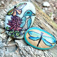 two painted rocks with dragonflies on them