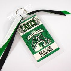 a green and white lanyard tag with a name tag attached to it that says cheer arridel