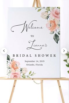 a sign with flowers on it that says welcome to lana's bridal shower