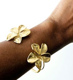 Gold Flowers Bracelet,  Artisan Jewelry, Cuff, Bangle This beautiful flower bracelet is designed with detail. Very delicate and dainty. For a size 7.5" wrist.  Still shopping? Lovely. www.etsy.com/shop/KheperaAdornments  Yes...Customer service is my greatest priority. Bohemian Flower Cuff Bracelet As A Gift, Bohemian Flower Cuff Bracelet As Gift, Handmade Flower Shaped Elegant Bangle, Handmade Elegant Flower Bangle, Bohemian Flower Cuff Bracelet, Adjustable Flower Cuff Bracelet For Spring, Elegant Flower Cuff Bracelet, Gold Flower-shaped Bracelet With Flower Decoration, Elegant Flower Shaped Cuff Bracelet