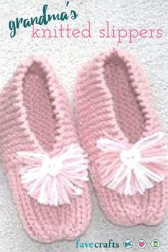 pink crocheted slippers with white tassels on the front and bottom