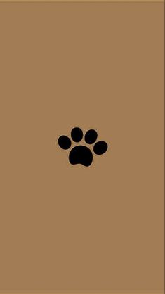 an animal paw print on a brown background