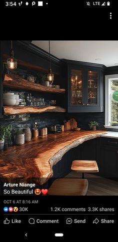 an image of a kitchen counter top that is made out of wood and has black cabinets