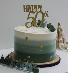 a white and green cake sitting on top of a table