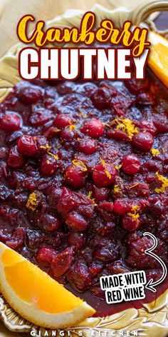 cranberry chutney made with red wine and orange slices on a plate