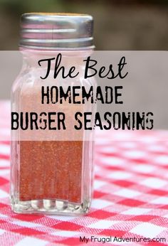 the best homemade burger seasoning recipe in a glass jar on a red and white checkered tablecloth