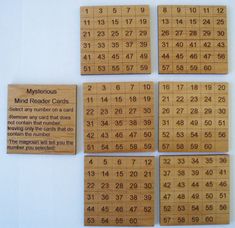 four wooden numbered cards with numbers on them and one has the same number in each card