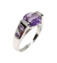 This stunning 925 sterling silver designer tension set amethyst statement ring is crafted with precision and character. A light amethyst stone sits above the striking square design giving it a sophisticated finishing touch. Wear this statement ring as an everyday accessory, or add it to your wedding collection - the possibilities are endless! Beautiful Amethyst statement ring made with 925 sterling silver. Amethyst is a heart chakra stone, known as the stone of love, family, and loyalty. Amethys Handmade Wedding Rings, Light Amethyst, Everyday Accessories, Proposal Ring, Anniversary Gift For Her, Amethyst Stone, Handmade Wedding, Amethyst Ring, Anniversary Rings