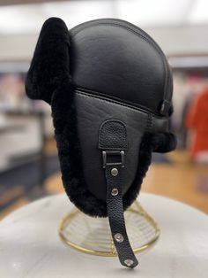 Description Indulge in luxurious warmth with our Genuine Merino Shearling Leather Hat. Made from natural merino shearling leather, this ear flap hat will keep you stylishly cozy. Feel the softness of genuine shearling as it keeps you protected from the elements. Product Details: 100% Genuine Sheepskin Natural twin-faced shearling Merino wool insulation Lined for comfort One size fits all Made in Turkey Care Instructions: Spot clean when necessary. Wool Insulation, Flap Hat, Ear Flap Hats, Leather Hat, Aesthetic Stuff, Leather Hats, Fashion Aesthetic, One Size Fits All, Merino Wool