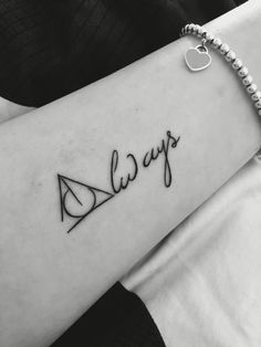 a woman's arm with the word always written on it