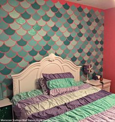 a bedroom decorated in pastel colors with mermaid scales on the wall