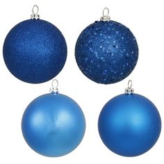 three blue christmas ornaments are shown against a white background