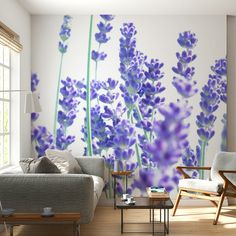 a living room with purple flowers painted on the wall